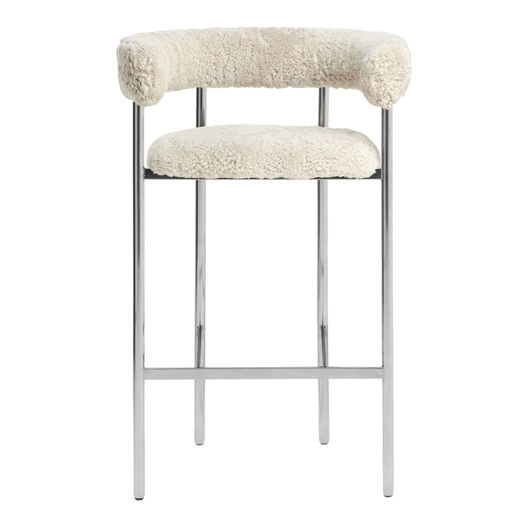 Cream-colored bar stool with a plush, textured fabric and sleek chrome legs. Ideal for modern decor.