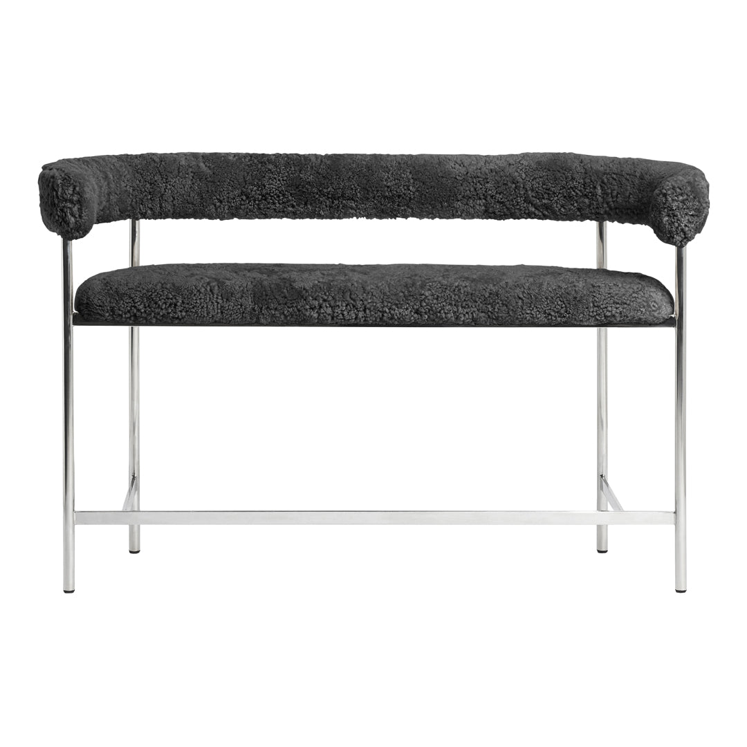 Modern bench in soft gray upholstery with textured pattern and sleek chrome frame. Ideal for contemporary decor.