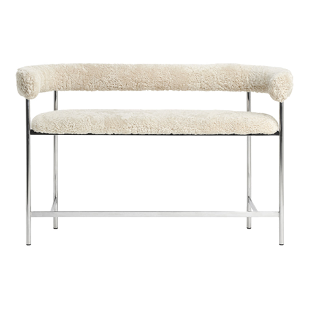 Cream faux shearling bench with stainless steel frame, featuring a minimalist design and soft, textured upholstery.