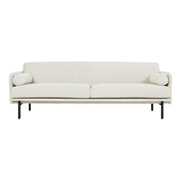 Cream-colored, minimalist sofa with subtle texture and decorative round cushions on each side.