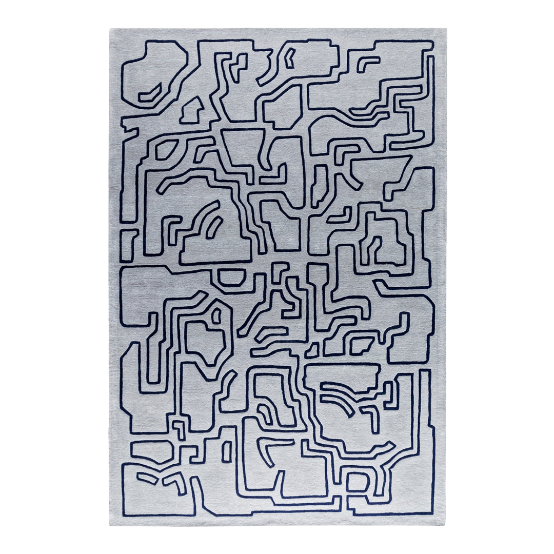 Abstract gray rug with navy blue geometric lines creating a contemporary maze pattern. Ideal for modern decor.