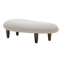 Cream-colored tufted ottoman with smooth, rounded edges and dark wooden legs, adding a modern accent to any space.