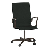 Black ergonomic office chair with sleek lines and a smooth fabric finish, complemented by a dark metal base.