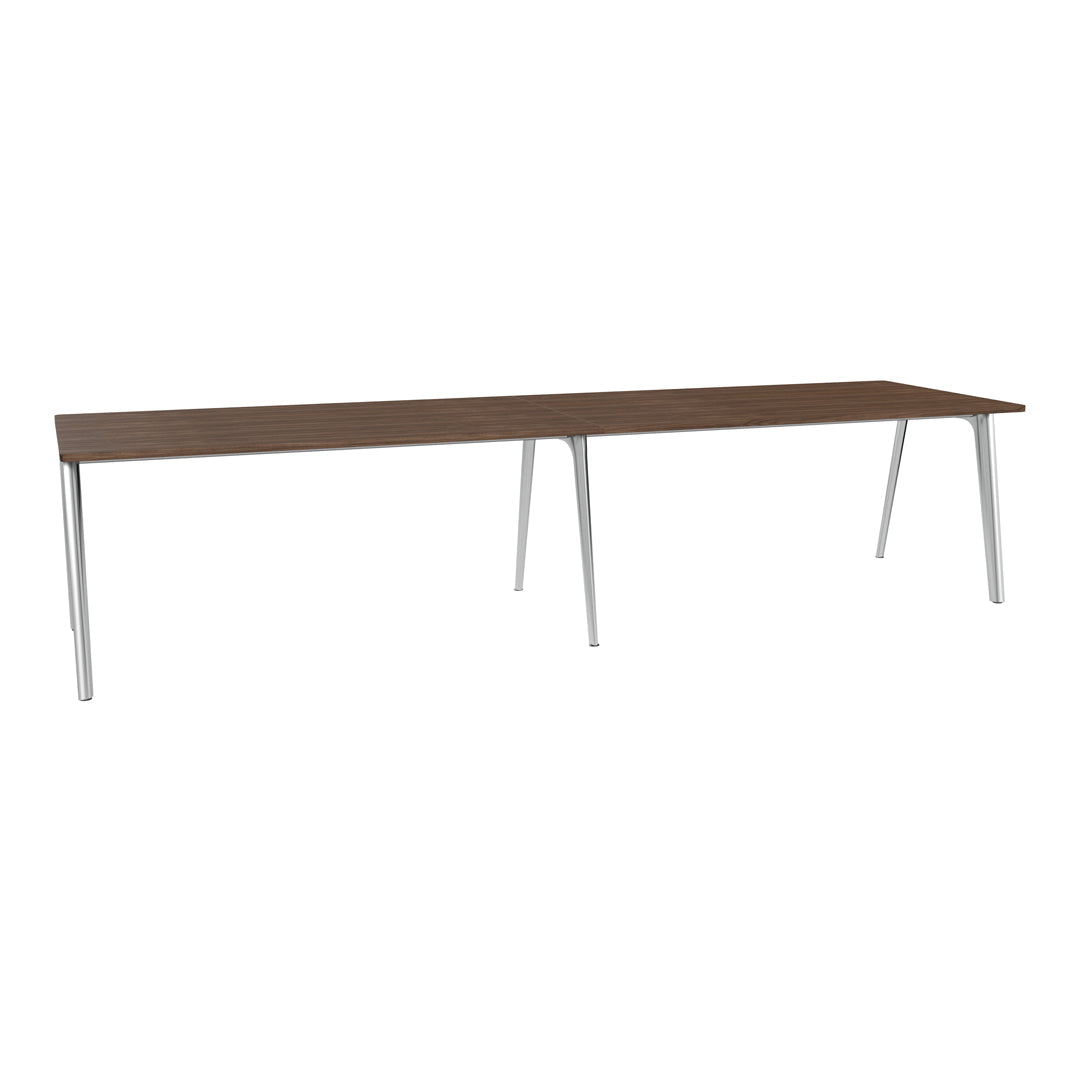 Long wooden table with a rich brown finish and sleek silver legs, featuring a minimalist design and smooth surface.