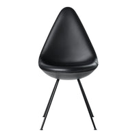 Black teardrop chair with sleek, smooth surface and minimalist black metal legs, perfect for modern decor.