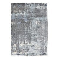 Abstractive gray area rug with blue patterns, featuring a distressed modern design for a contemporary look.