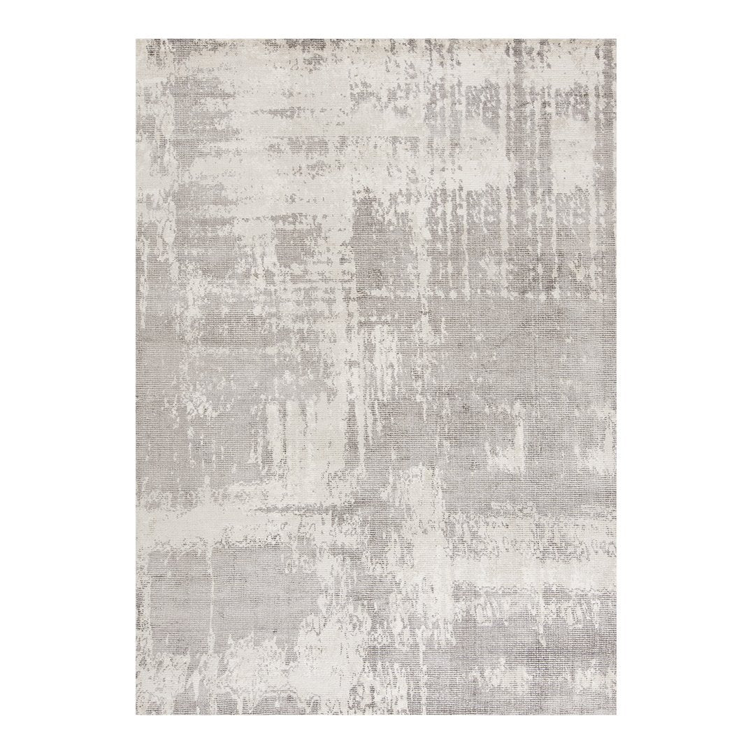 Abstract gray area rug with a textured pattern and subtle variations for a modern, minimalist look. 