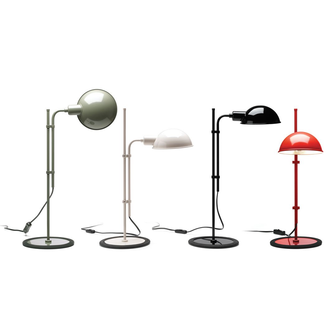 "Set of four modern lamps in green, white, black, and red, each with unique shapes and patterns on their shades."