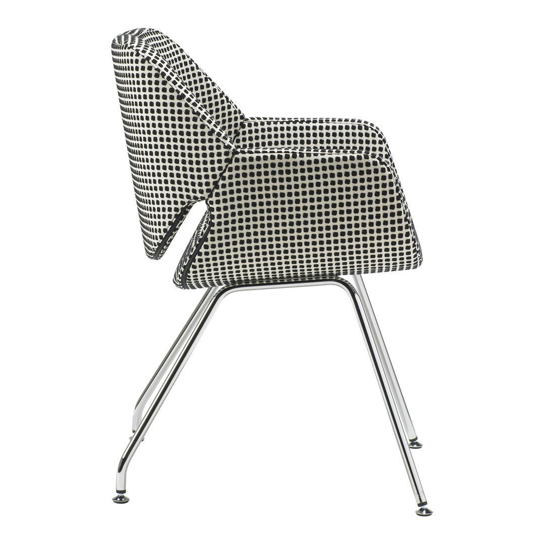Black and white houndstooth patterned chair with a sleek chrome base, perfect for modern decor.