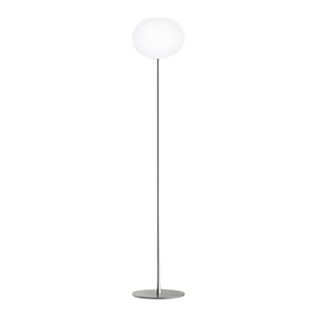 Sleek silver floor lamp with a round white glass shade, perfect for modern decor.
