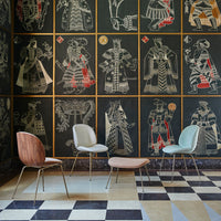 "Stylish chairs in soft pastels on a contrasting black and cream patterned floor with vibrant wall art."