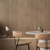 Neutral wood backdrop with warm beige chairs, featuring subtle textures and a modern, minimalist aesthetic.