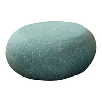 Teal round pouf with a subtle speckled pattern, perfect for adding a pop of color to any space.