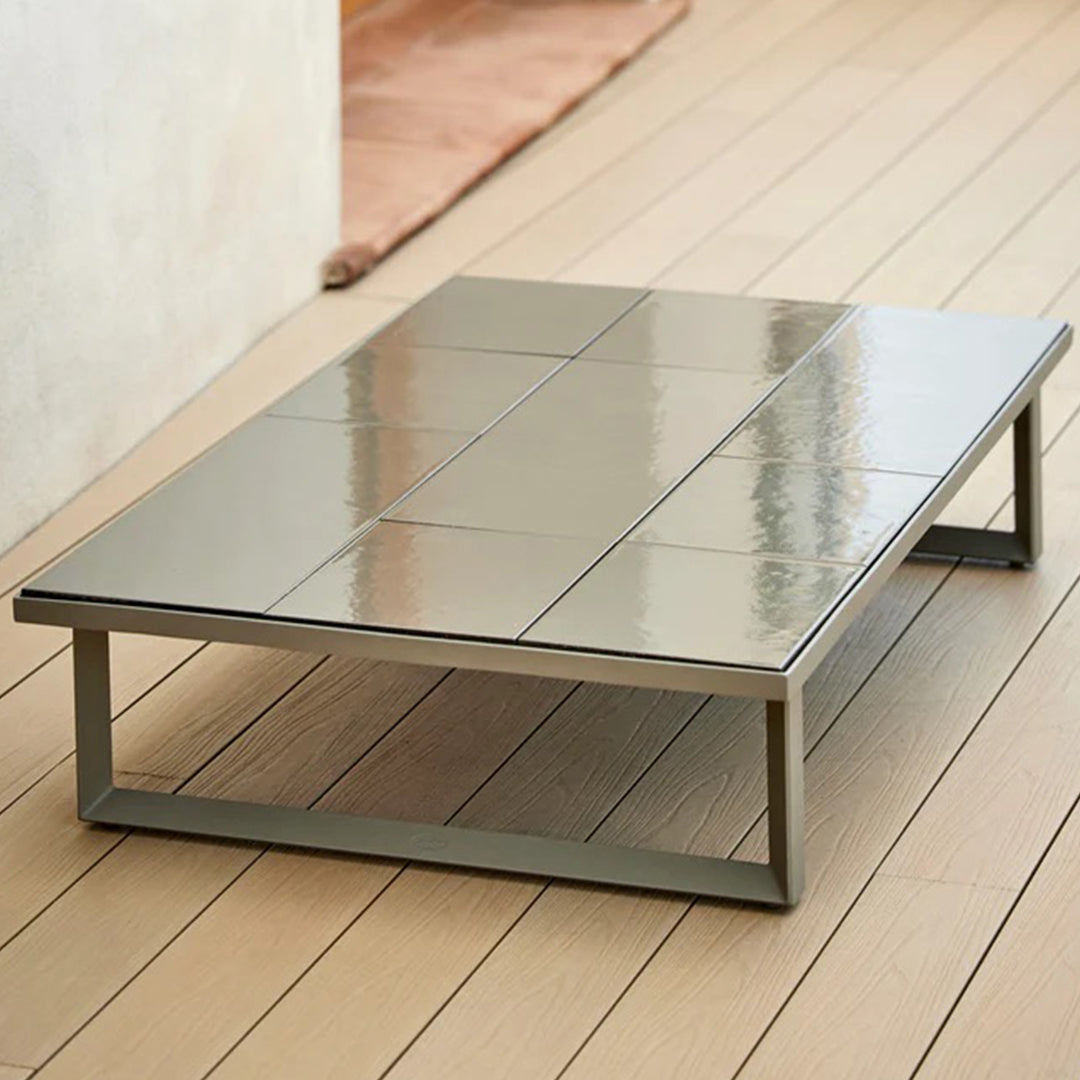 Stylish gray ceramic coffee table with a sleek, glossy finish and modern geometric pattern. Perfect for any contemporary space.