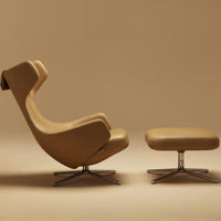 Tan ergonomic chair with sleek curves and matching ottoman on a beige background, showcasing minimalist design.