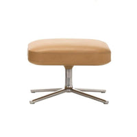 Tan leather ottoman with a sleek silver base, featuring a smooth, minimalistic design. Perfect for modern decor.