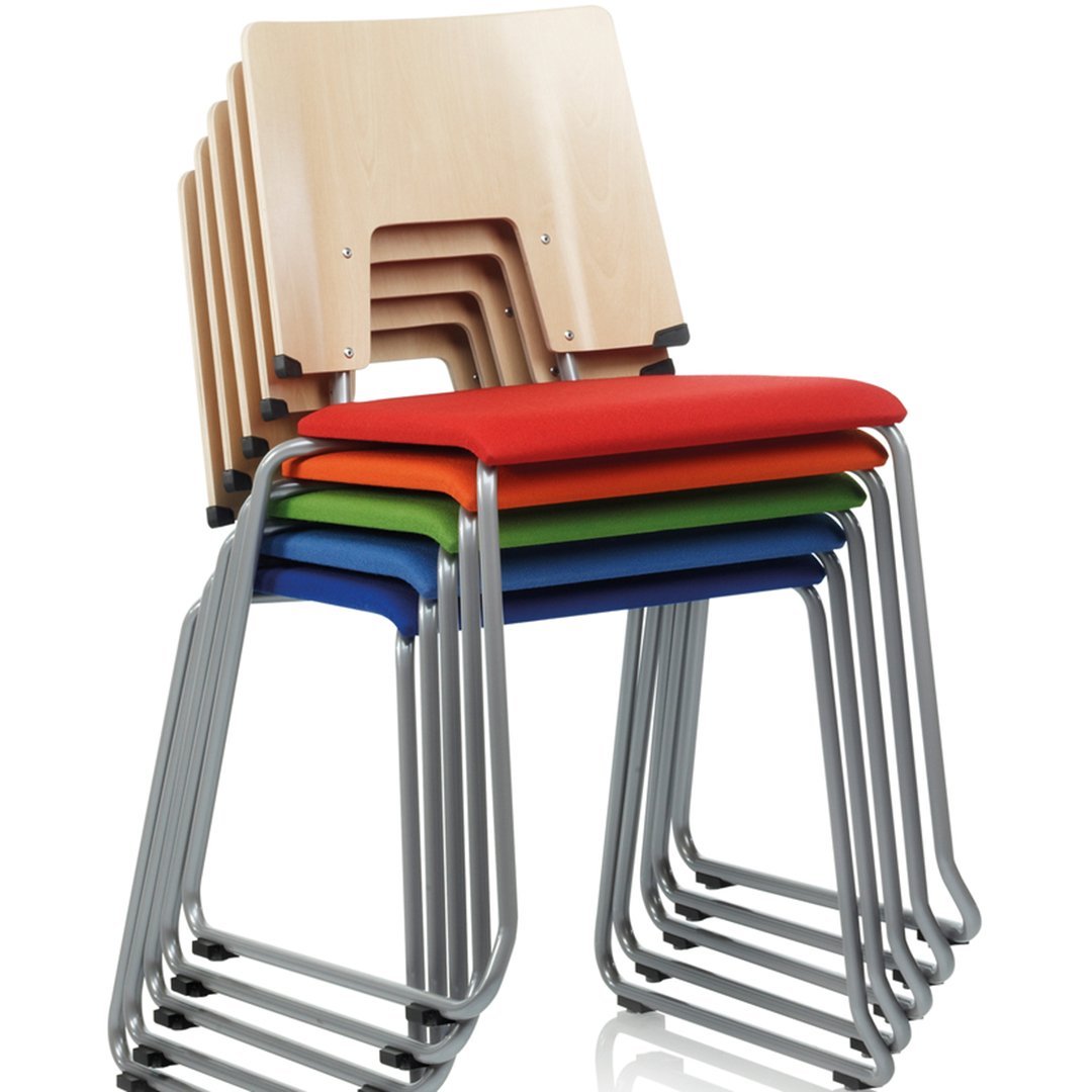 Stacked chairs featuring a natural wood finish and vibrant red, green, blue, and gray cushions.