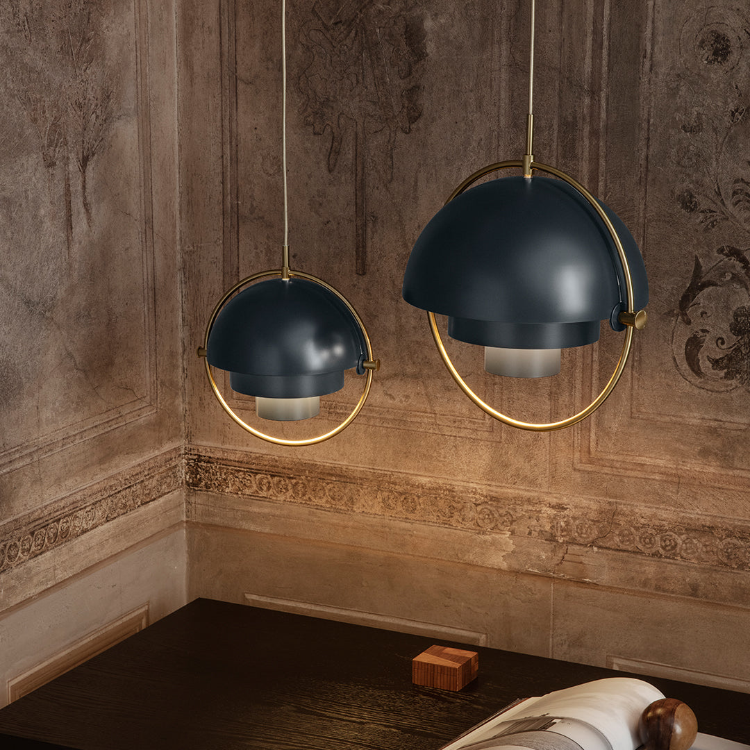 Navy blue pendant lights with gold accents, featuring a sleek, modern design and soft glow. Ideal for stylish decor.