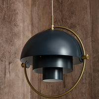 Navy blue dome pendant lamp with brass accents and modern geometric design. Ideal for contemporary home decor.