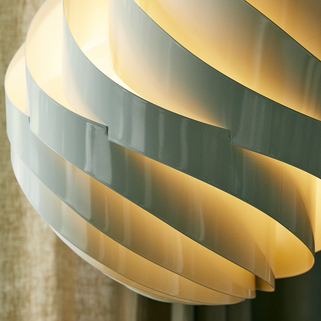 Modern pendant light with soft beige and white twisted layers, creating an elegant, warm aesthetic. Ideal for contemporary spaces.