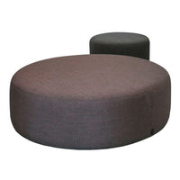 Round poufs in subdued gray and deep maroon fabric, featuring a textured finish for a modern touch.