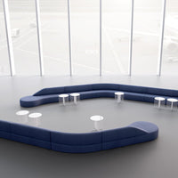 Curved navy blue seating with sleek white tables on a minimalist gray floor. Modern, stylish, and versatile design.