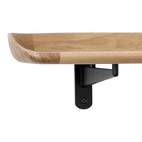 Natural wood shelf with a smooth oak finish and contrasting black metal bracket. Sleek and modern design elements.