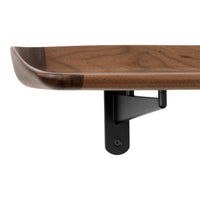 Walnut wood shelf with smooth, curved edges and a sleek black metal bracket, showcasing warm brown hues and elegant patterns.