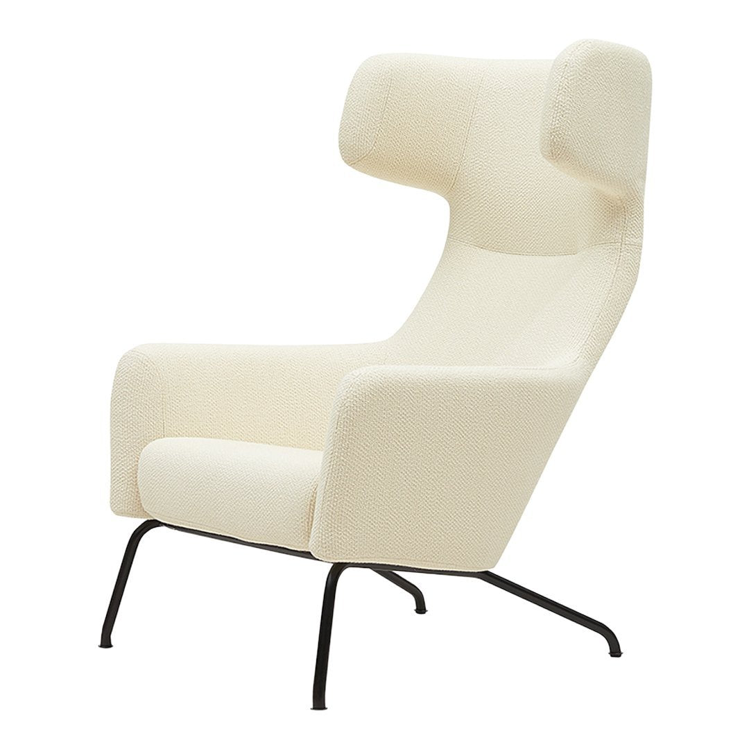 Cream upholstered chair with a modern design, featuring a minimalist style and black metal legs.