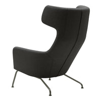 "Modern gray armchair with a sleek silhouette and minimalist design, featuring a subtle textured fabric."