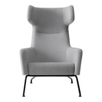 Light gray accent chair with a smooth upholstery, featuring a modern silhouette and minimalist black metal legs.