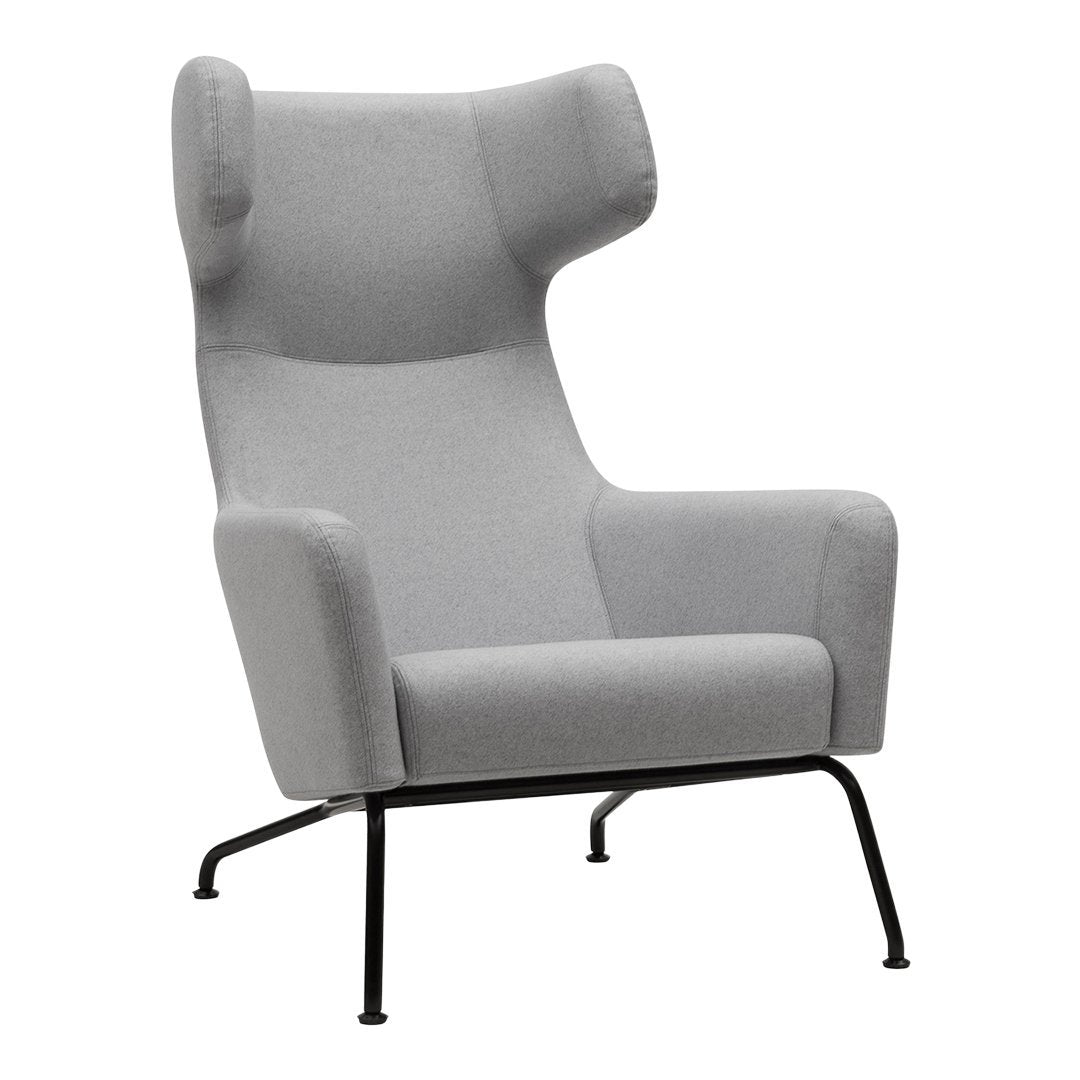Gray upholstered armchair with a minimalist design and black metal legs, featuring smooth, solid color fabric.