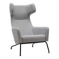 Gray upholstered armchair with a minimalist design and black metal legs, featuring smooth, solid color fabric.