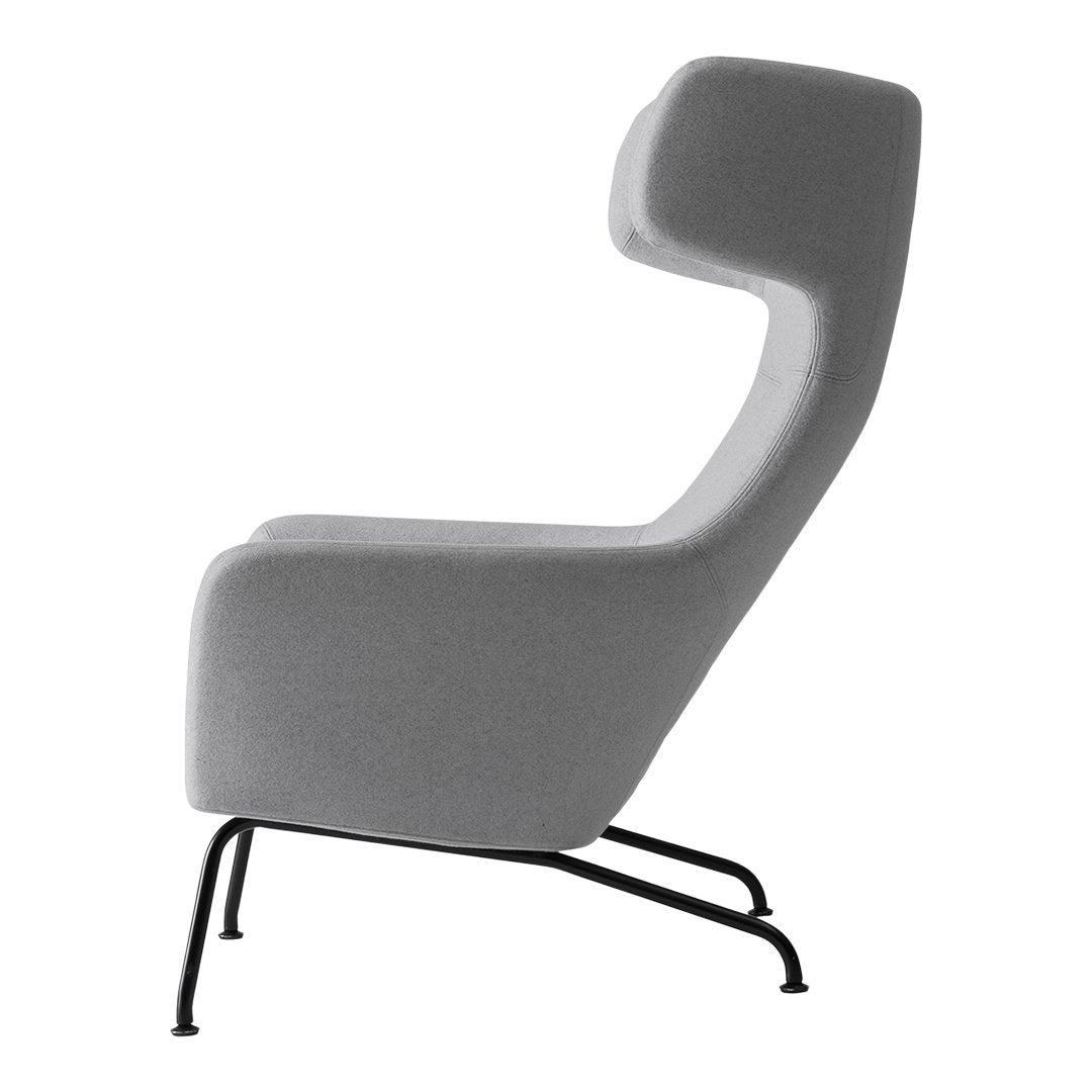 Gray upholstered chair with smooth, minimalist design and contrasting black metal legs. Perfect for modern decor.