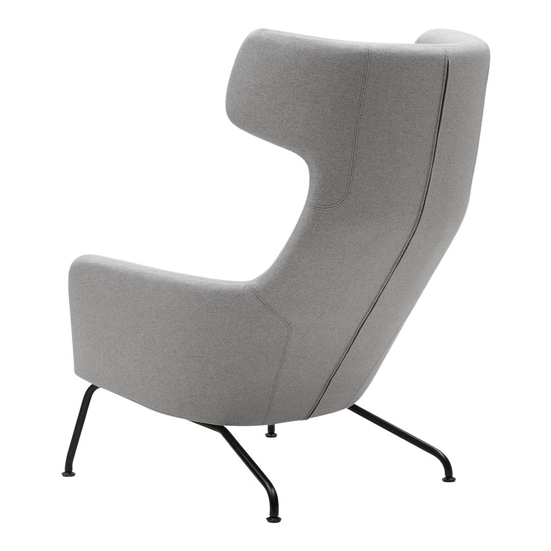Gray upholstered accent chair with a modern design and sleek black metal legs. Minimalist and stylish.