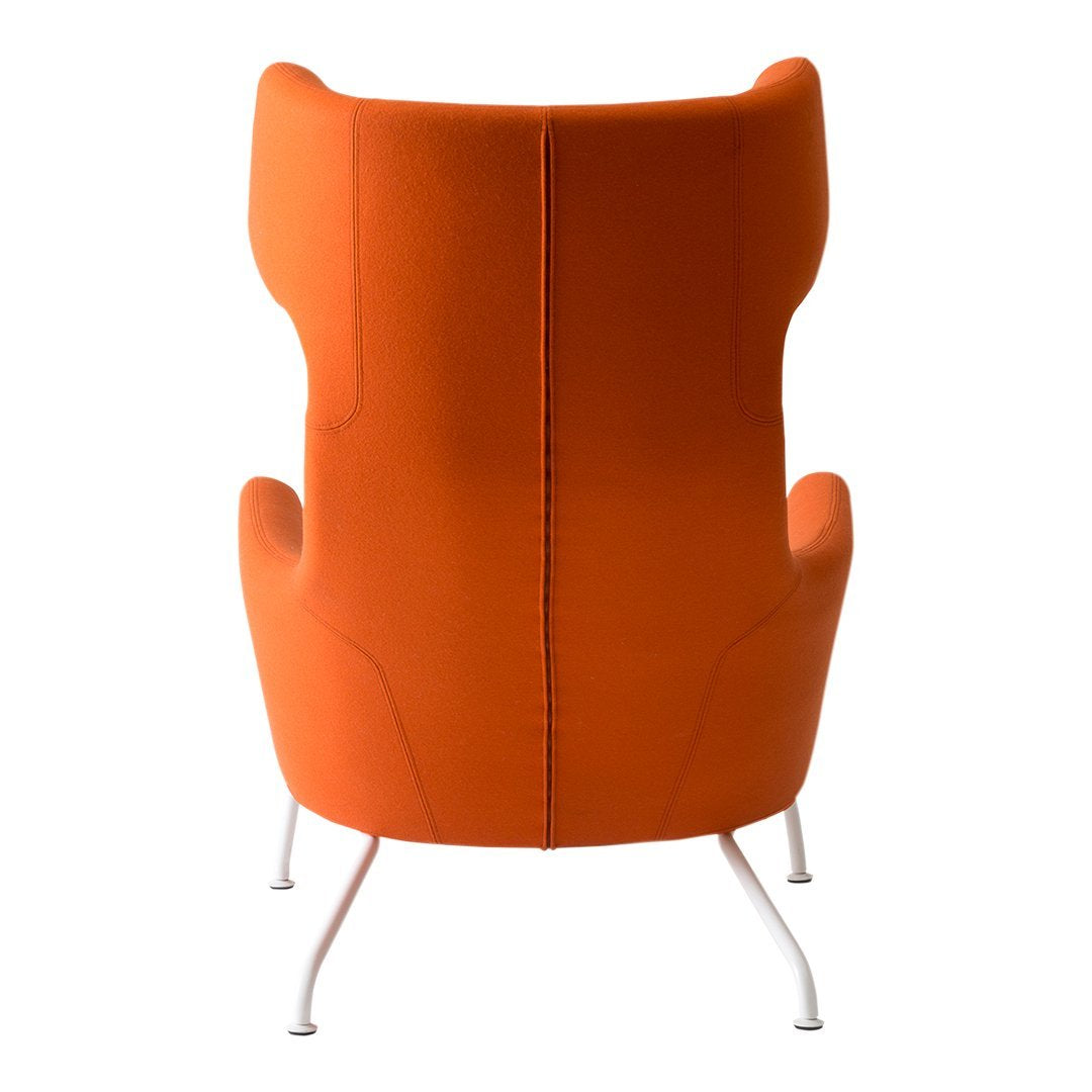 Orange upholstered chair with a sleek, modern silhouette and silver legs, showcasing a vibrant solid color design.