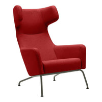 Red wingback armchair with a smooth fabric finish and minimalist metal legs, perfect for modern decor.