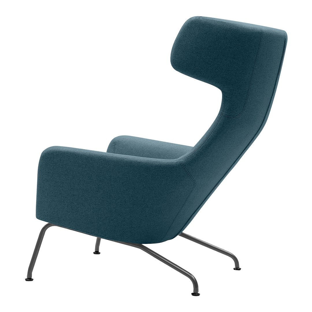 Modern teal armchair with a sleek design and smooth upholstery, featuring minimalist black metal legs.