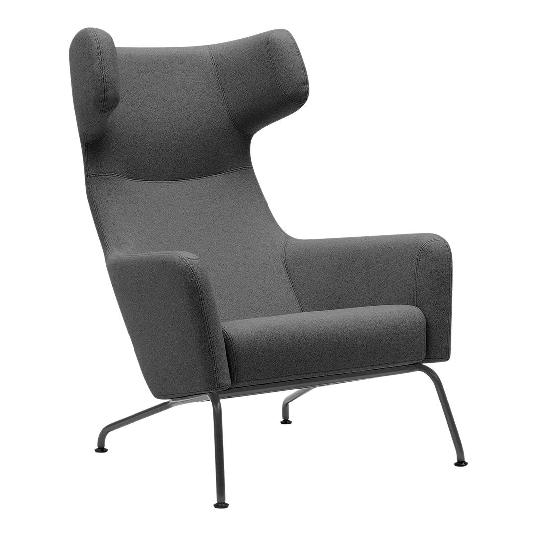 Gray upholstered armchair with a minimalist design and smooth, modern lines, featuring a sleek metal frame.