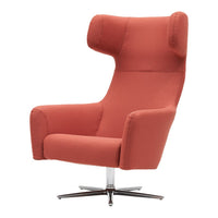 Coral-colored accent chair with a sleek, modern design and soft, textured upholstery.