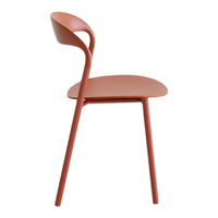 Rust-orange modern chair with a sleek, minimalist design and smooth contours. Perfect for contemporary decor.