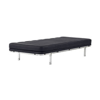 Black upholstered daybed with horizontal stitching on a sleek chrome frame, offering a modern minimalist aesthetic.