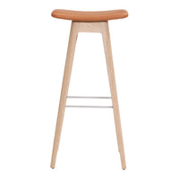 Light wood bar stool with a natural finish and a smooth, warm tan seat. Minimalistic design with clean lines.
