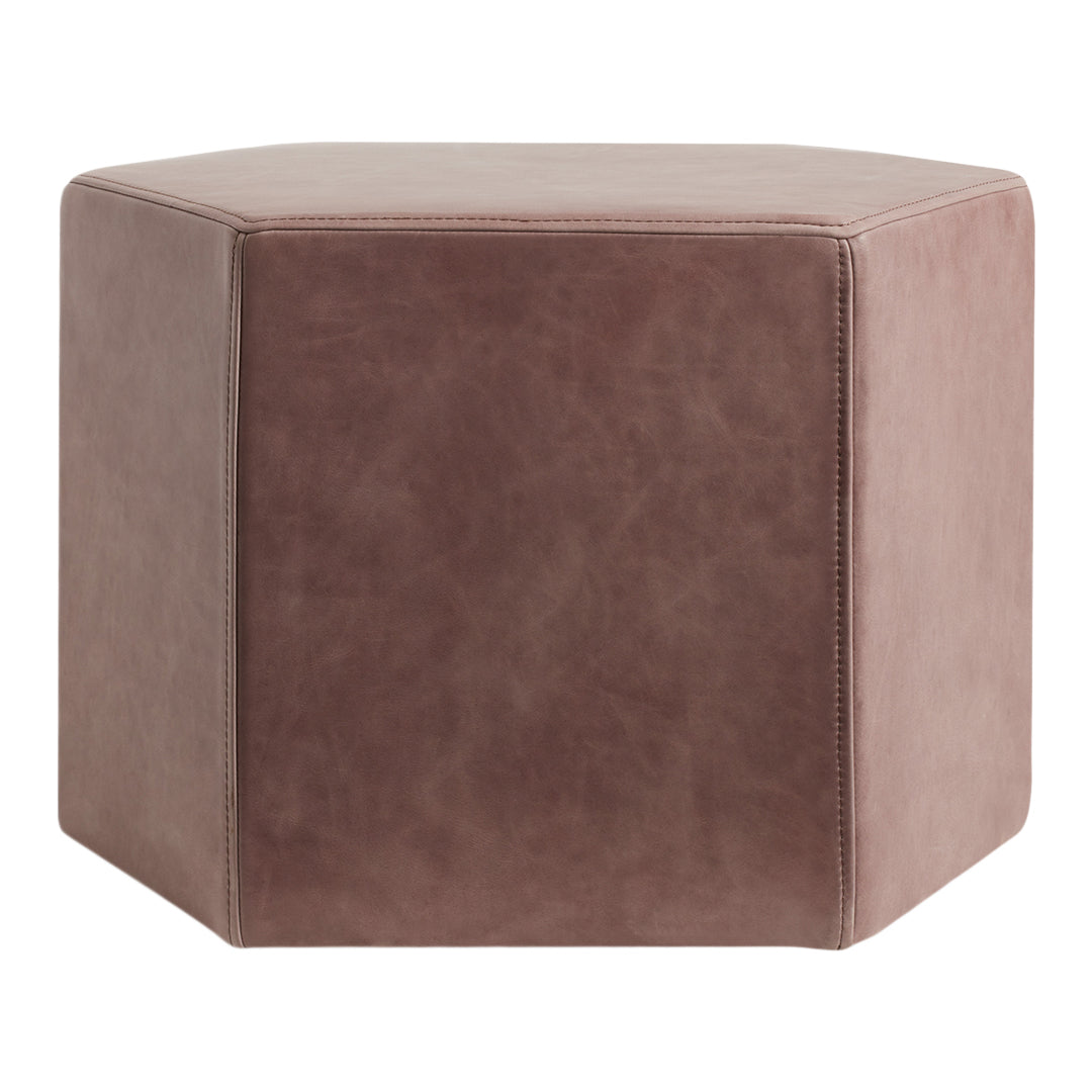 Hexagonal leather ottoman in soft taupe color with a matte finish. Minimalist design suits any decor style.