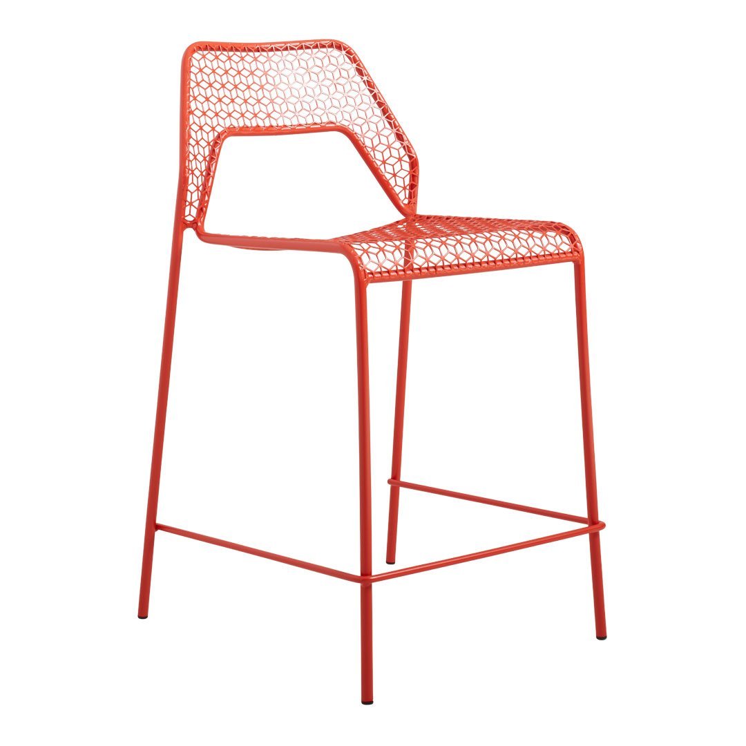 Vibrant red metal bar stool with a geometric cut-out pattern for a modern, stylish touch. Perfect for outdoor or indoor use.