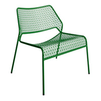 Green mesh lounge chair with a modern geometric pattern, perfect for outdoor and indoor settings.