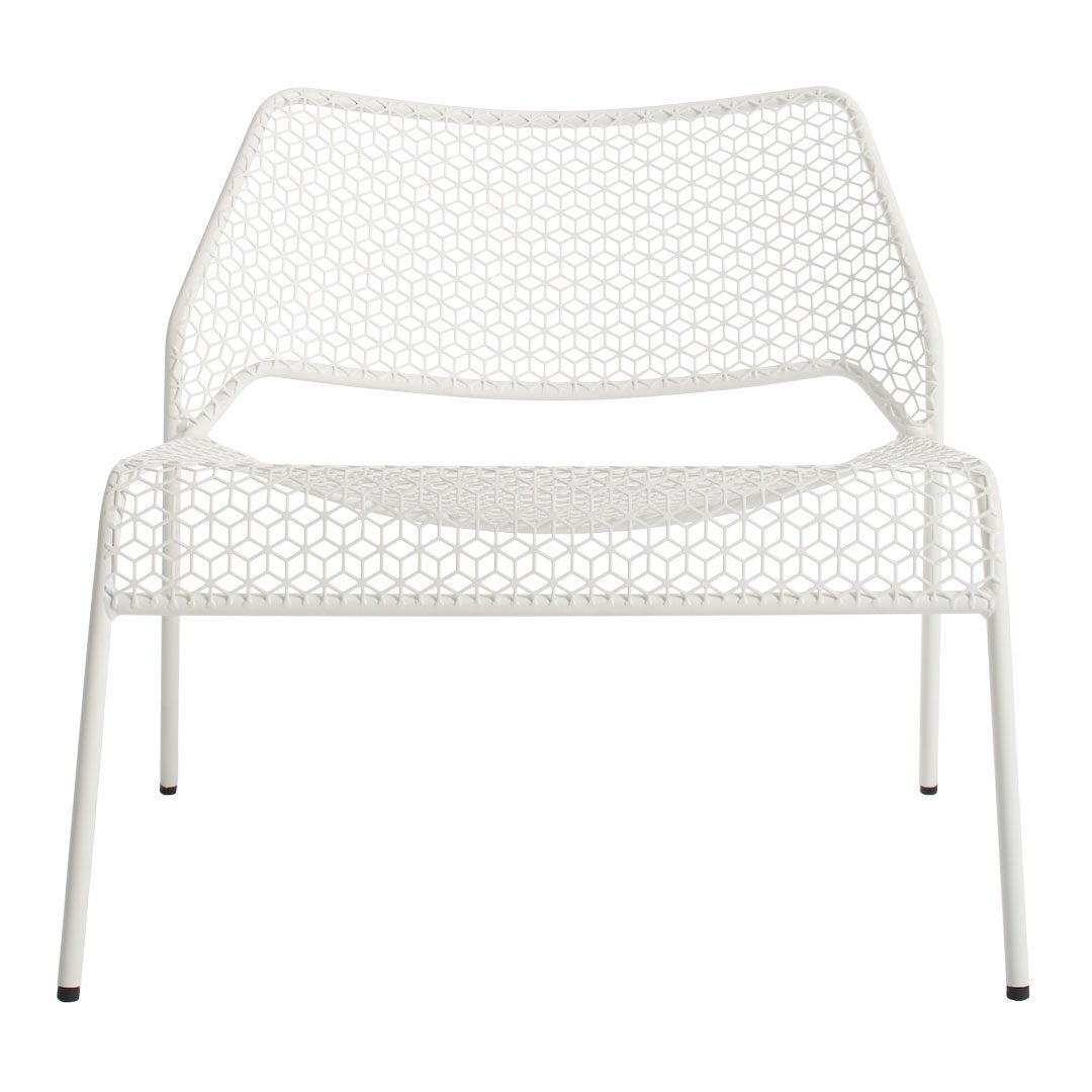White woven lounge chair with a geometric pattern and sleek, minimalist design, perfect for modern decor.