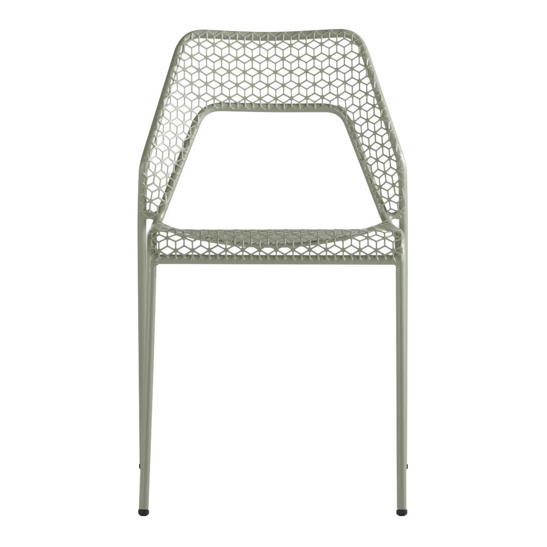 Light green chair featuring a geometric open weave pattern, perfect for modern decor.