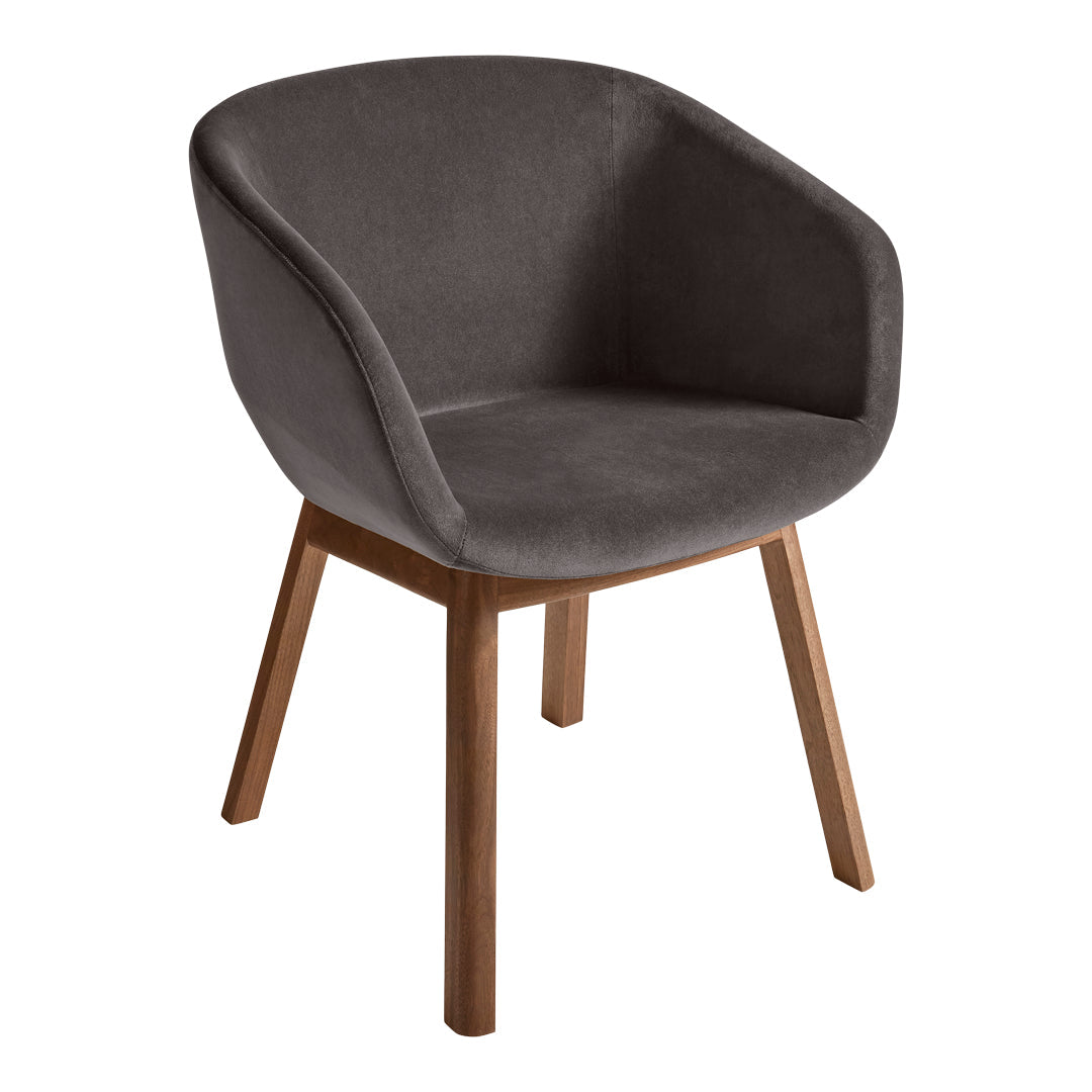 Stylish gray velvet chair with wooden legs, featuring a smooth, modern design perfect for any decor.