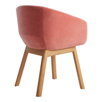 Pink velvet chair with a smooth finish and wooden legs, offering a modern and stylish accent for any room.
